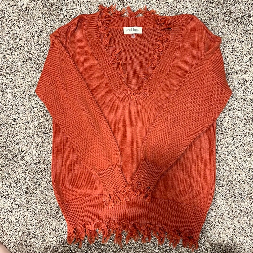 Slightly oversized distressed sweater